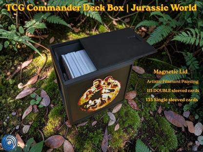Jurassic World-themed TCG Commander deck box, UK-made 3D-printed EDH vault with HueForge artistic filament painting dinosaur design, magnetic lid, commander card display window with free premium toploader, holds 115 double-sleeved or 135 single-sleeved cards, compatible with MTG, One Piece TCG, Disney Lorcana, Flesh and Blood, Yu-Gi-Oh, Pokémon, photographed in jungle forest setting