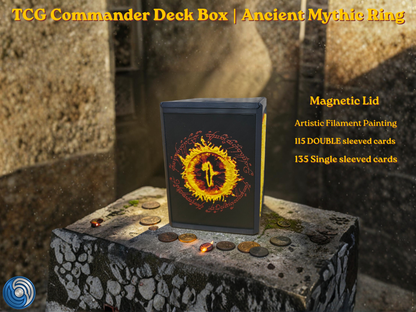 Black 3D printed TCG Commander deck box placed on a stone ritual altar background with glowing coins. The front face features a highly detailed, textured 2.5D filament painting in vibrant gold and yellow, depicting an ancient fantasy spellbook cover with an inscribed burning mythic ring. Text overlay highlights a magnetic lid and a capacity of 115 double-sleeved or 135 single-sleeved cards.