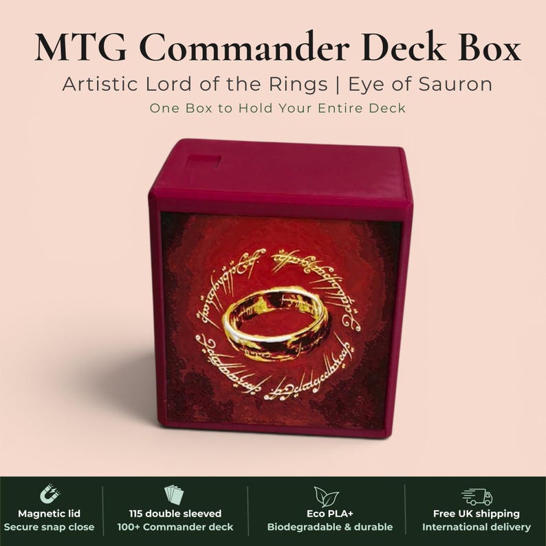 Lord of the Rings Eye of Sauron MTG Commander deck box — 3D printed PLA+, handcrafted in the UK. Features the fiery Eye of Sauron and One Ring with Elvish rune inscriptions in crimson and gold. Magnetic closure, holds 115+ double sleeved cards, hero display compartment included. Available in black, burgundy red or forest green. Perfect for MTG EDH, Lorcana, Pokémon TCG fans.